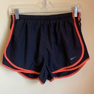 Black and orange Nike Dri-Fit Tempo shorts, aka Norts